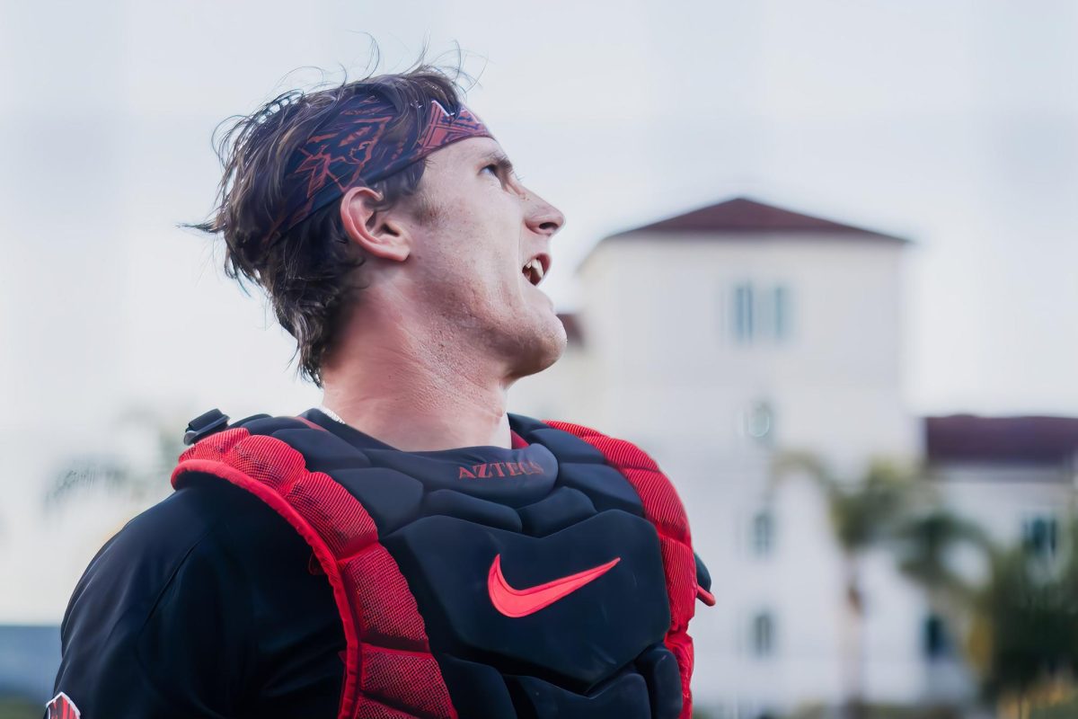 San Diego State senior catcher Gage Adams gets the energy up in the dugout after recording the third out on defense during the game against Cal State Fullerton at Tony Gwynn Stadium on Apr. 28, 2026. 