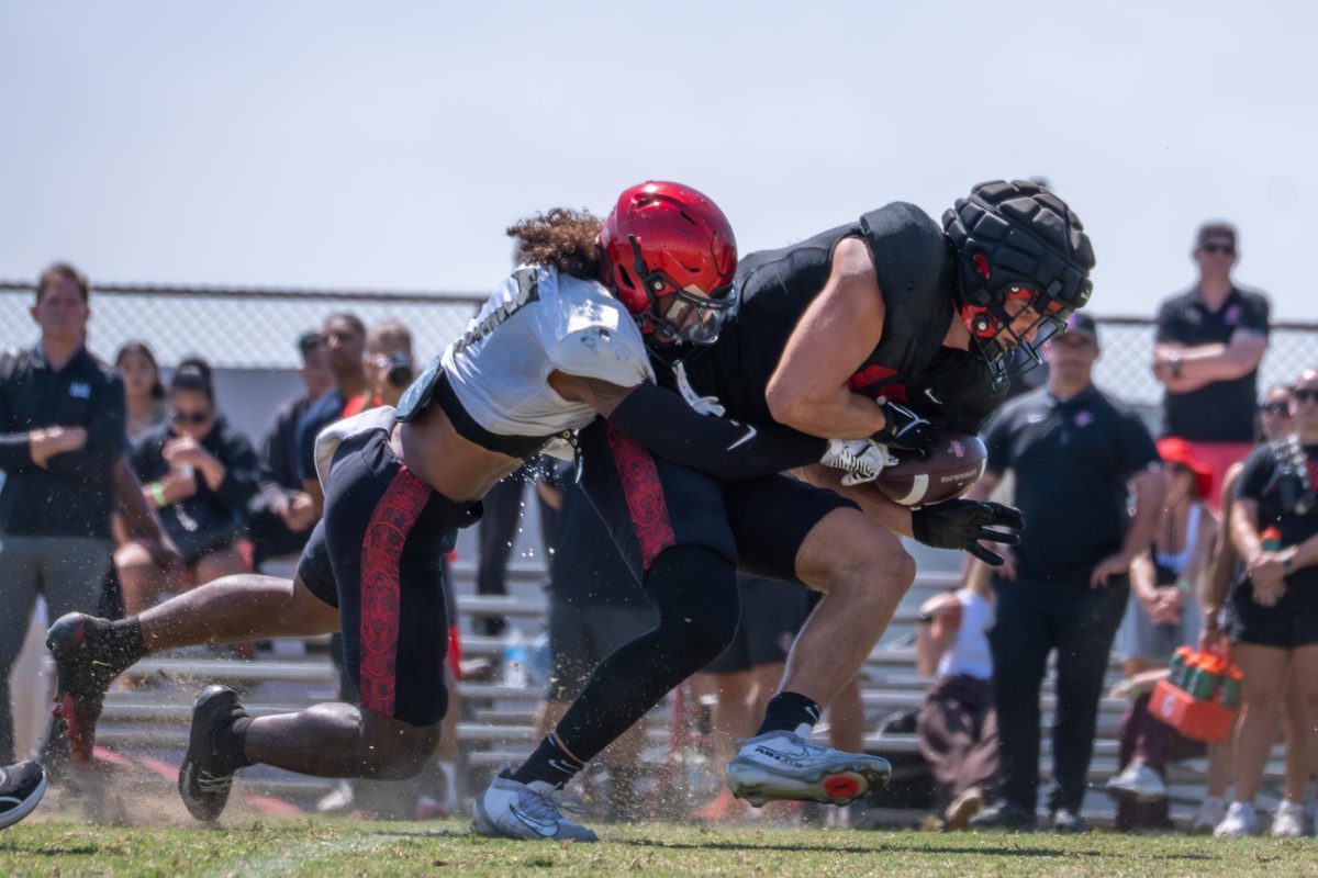 Tight end Jackson Ford (15) gets taken down after a big play at the spring game on Tuesday, May 2, 2026, at San Diego state university 