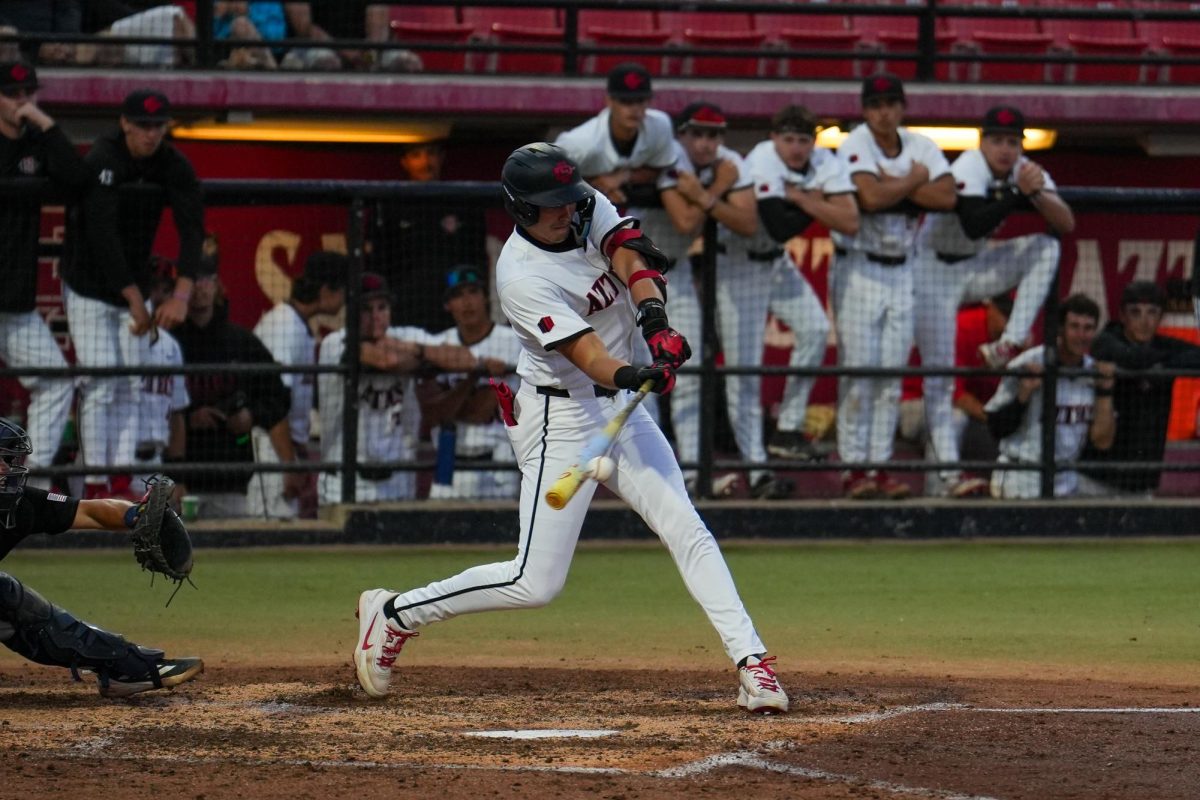 San Diego State's No. 3 Jake Jackson (Jr.) follows through on a swing during the Aztecs' 8-4 win against UC Irvine on March 24, 2026, at Tony Gwynn Stadium. 