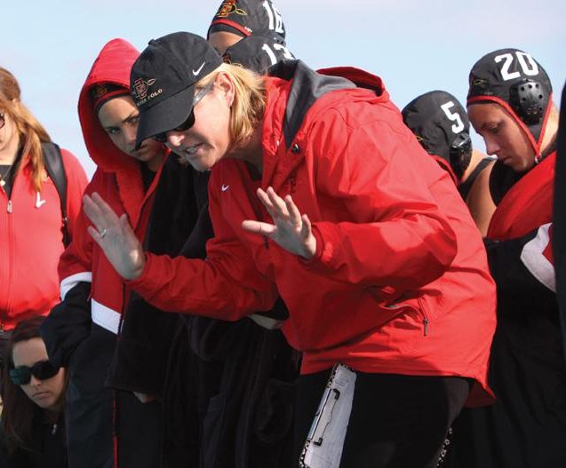 Head coach Carin Crawford speaks to her team in a game during the 2011 season.