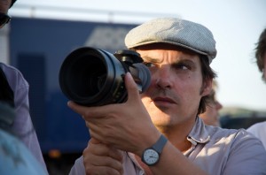 Joe Wright with a camera on the set of “Hanna.” After directing many dramatic films, Wright takes the chance to direct an action movie without all the bravado and kitsch that is usually associated with the genre, Courtesy of Jasin Boland